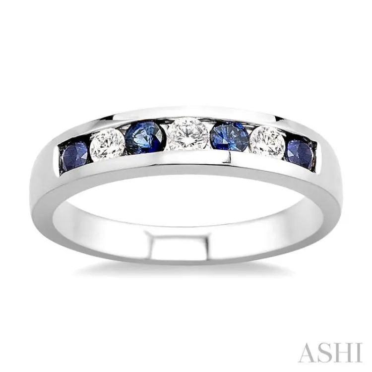 1/5 Ctw Channel Set Round Cut Diamond and 2.5 MM Round Cut Sapphire Band in 14K White Gold